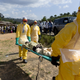 Health workers wearing protective suits carry a patient suspected of having Ebola on their way to an Ebola treatment center run by the French Red Cross in Macenta, Guinea, on Nov. 21, 2014.
KENZO TRIBOUILLARD/AFP/Getty Images